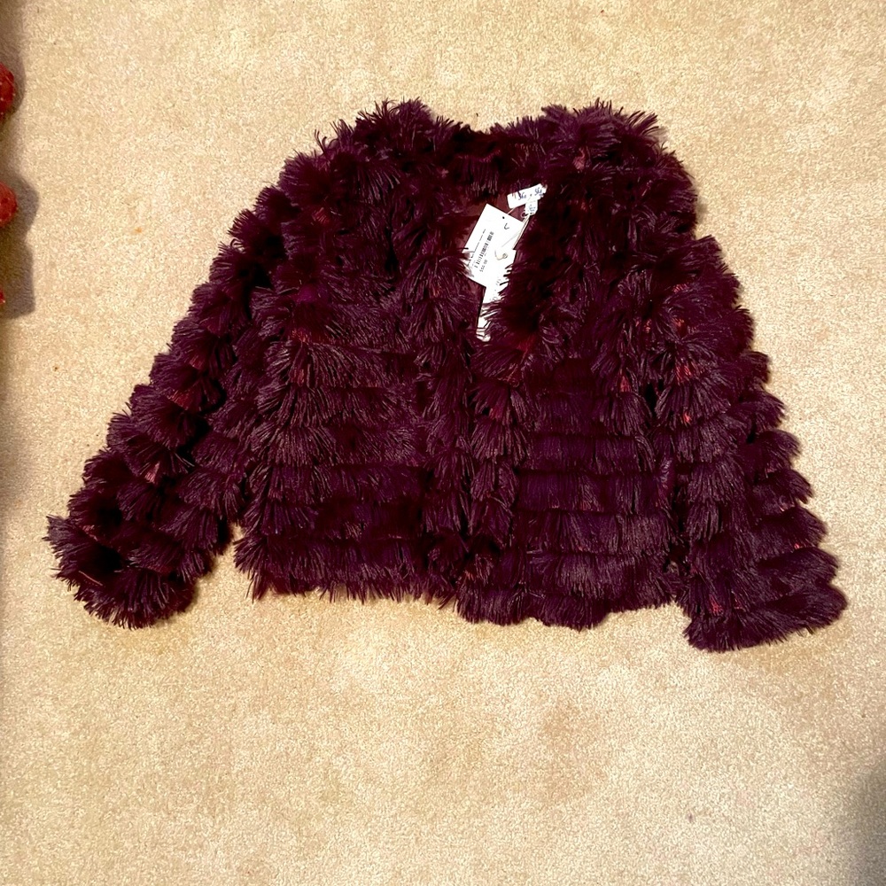 Fun, flirty textured jacket in a gorgeous maroon color.